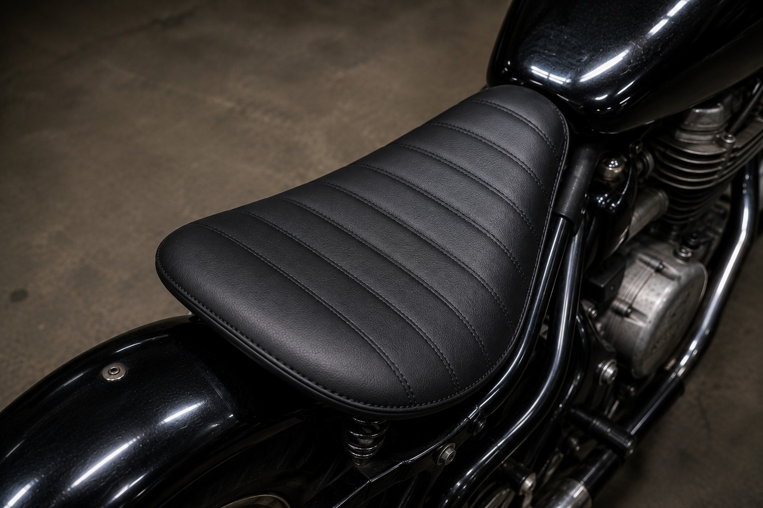 After: repaired motorcycle seat with clean stitching